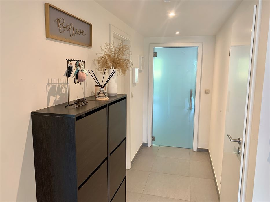 Absil Immobilière vous présente un superbe appartement avec jardin 